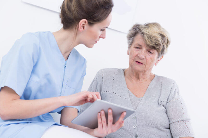 Clinician and patient looking at an ipad