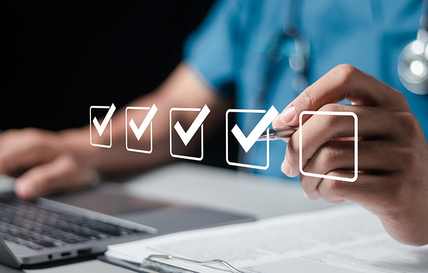 medical professional checking off accreditation requirements