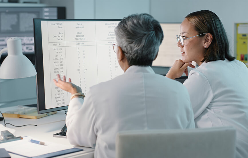 two medical staff looking at computer screens